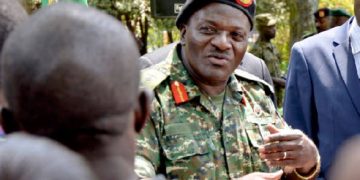 Asan Kasingye gives Gen. Katumba Wamala his flowers