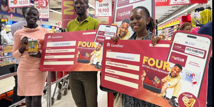 Some of the winners of the MyClub App holding their dummy vouchers during the MyClub Anniversary Celebrations at Carrefour Brach at Acacia Mall. (1)