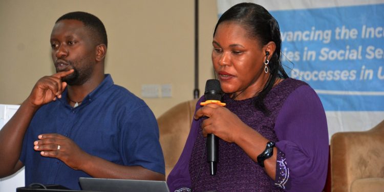 NUDIPU Chief Executive Officer Esther Kyozira(R)