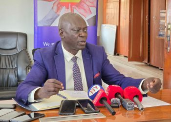 Walimu Cooperative Union Board Chairperson Steven Oringa speaks to journalists in Kampala.