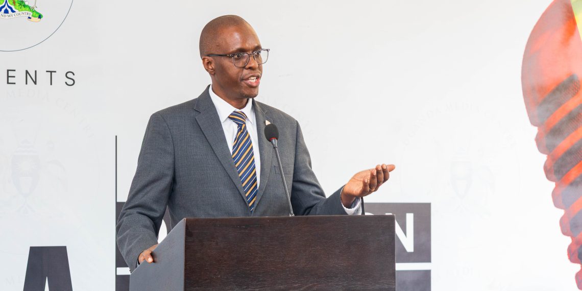 John Tumwine, the Executive Vice President, Public Sector, Corporate Investment Banking at Stanbic Bank Uganda aming remakrs during the launch at the Uganda Media Center