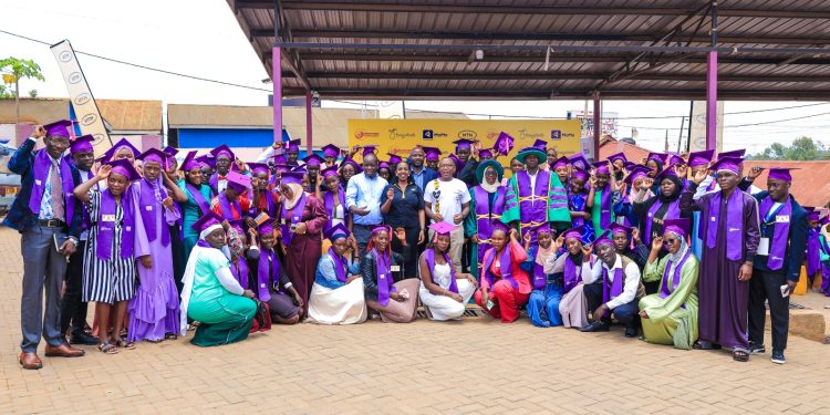 MTN Uganda and partners joins graduands for a group during the graduation ceremony.