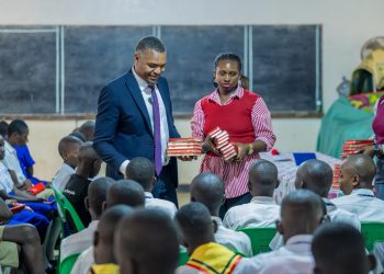 Jubilee Insurance donates scholastic material to two KCCA primary schools ahead of PLE