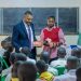 Jubilee Insurance donates scholastic material to two KCCA primary schools ahead of PLE