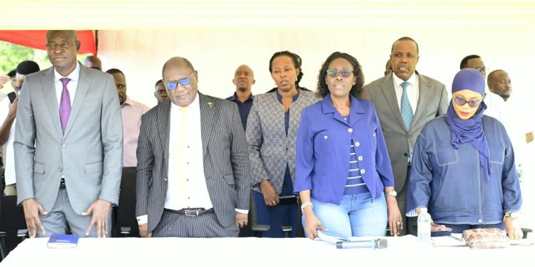 Dei BioPharma founder Dr Matthias Magoola, Attorney General Sam Mayanja, Lands Minister Judith Nabakooba and Investments Minister Aminah Mukalazi (left to right, front row) stand with other officials during the community meeting on the government’s land acquisition for Dei BioPharma’s expansion in Matugga, Wakiso District, on Friday.