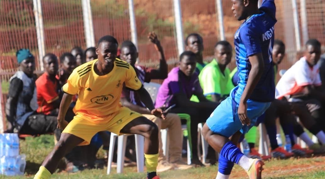 Kigulu-players-in-blue-press-forward-against-Butembe-during-a-closely-fought-encounter-in-Jinja.